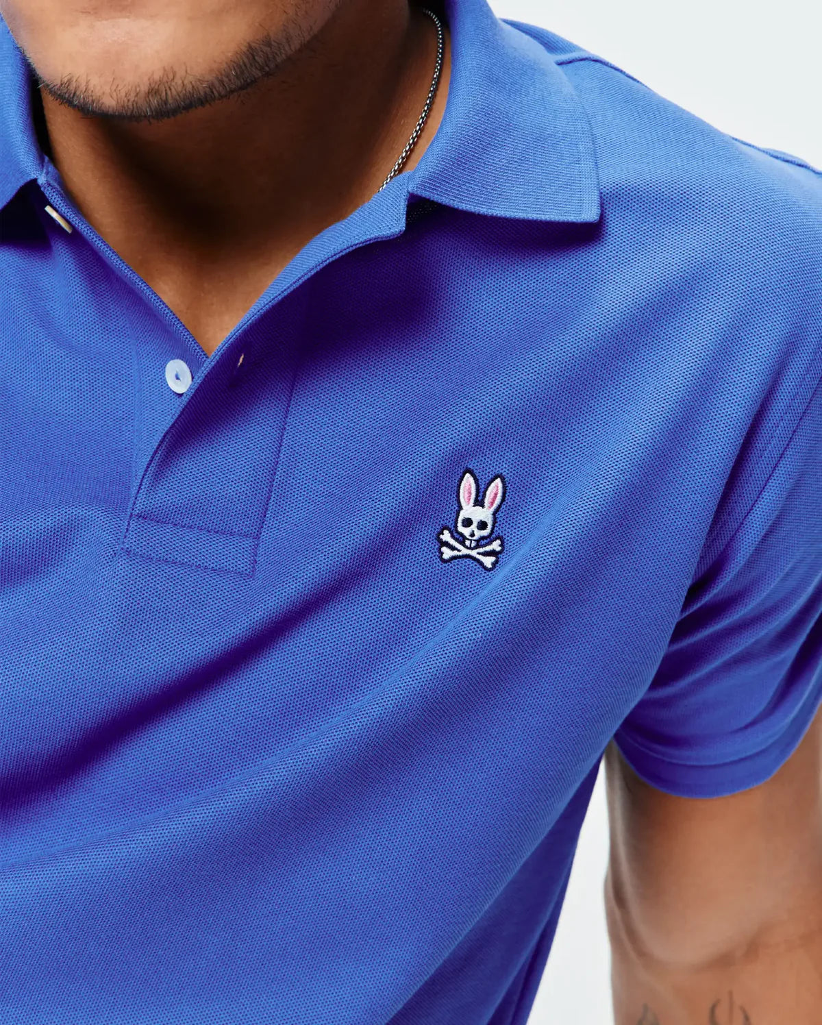 POLO M/C PSYCHO BUNNY PARA HOMBRE COLOR AZUL B6K001F200426