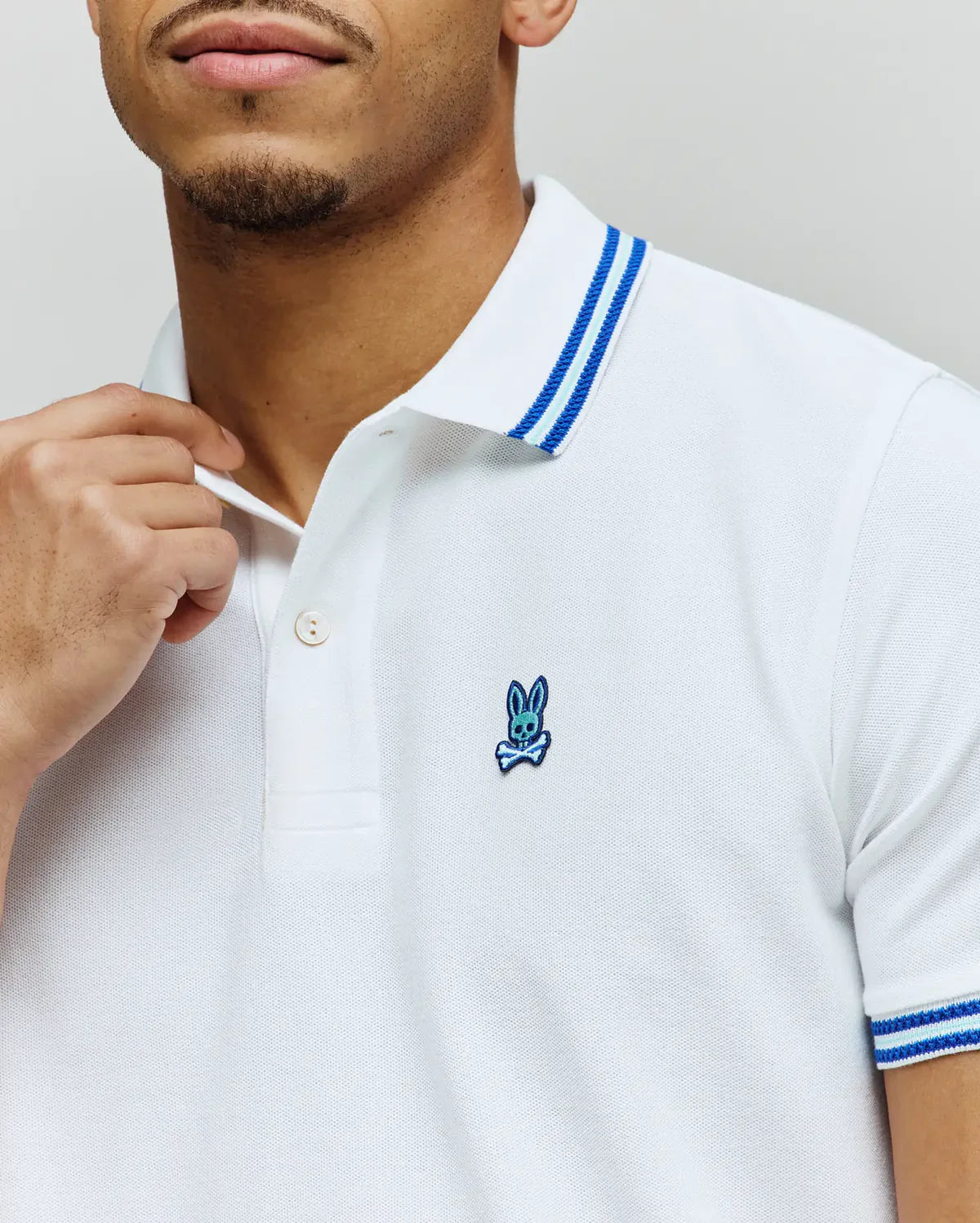 POLO M/C PSYCHO BUNNY PARA HOMBRE COLOR BLANCO MT0100127100
