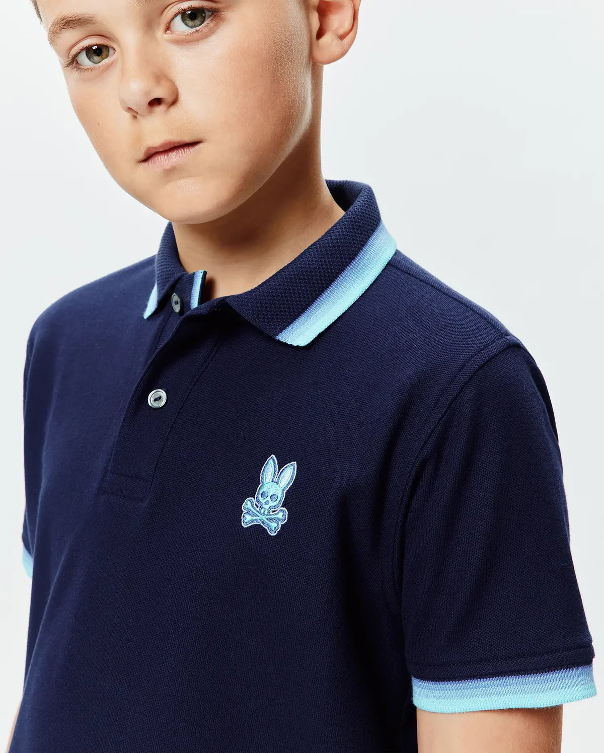 POLO M/C PSYCHO BUNNY PARA NIÑO COLOR AZUL KT0100100322